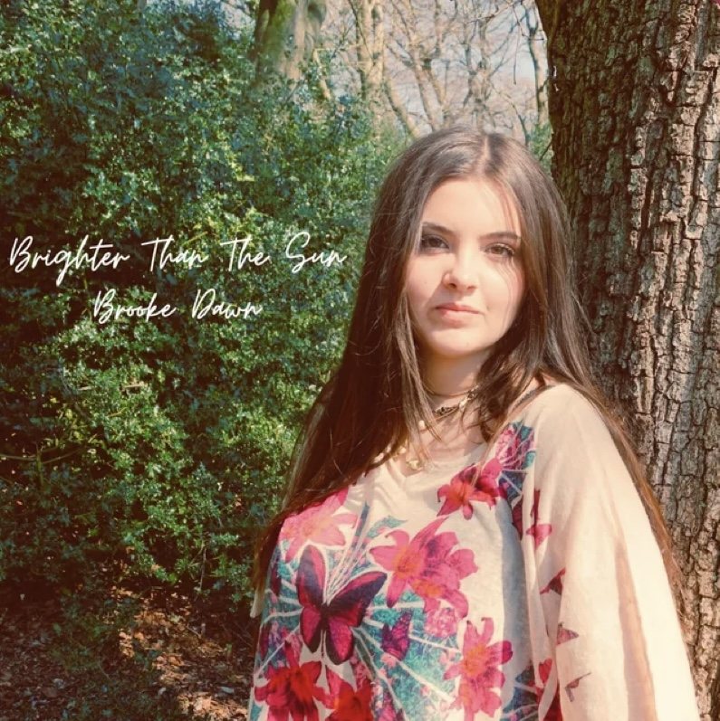 Brighter Than the Sun single artwork — Brooke Dawn standing by a tree